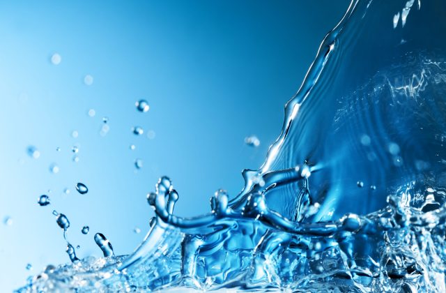 Splash of Water Abstract Splash of Water on a Blue Background